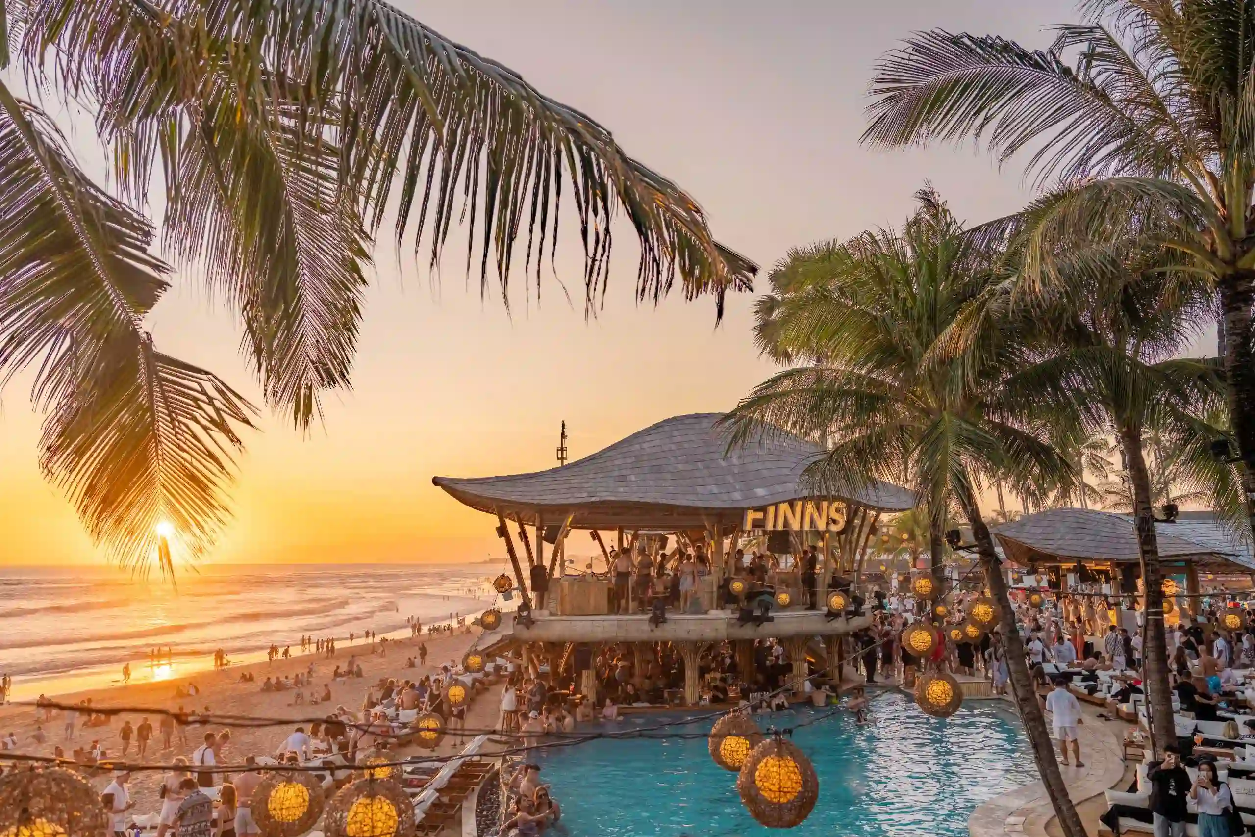 Vibrant beachside pool area and bamboo pavilion